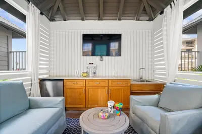 a kitchen with two chairs and a table in a room at Calypso Tower 3 Beach Resort in Panama City Beach