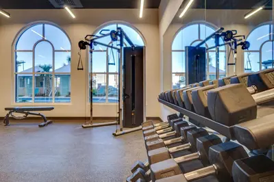 a gym with rows of chairs and windows at Calypso Beach Resort Tower 3 Rentals in Panama City Beach