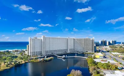 a view of a hotel with the ocean in the background at Spacious Resort Condo with Breathtaking Gulf Views! by Dolce Vita Getaways PCB in Panama City Beach