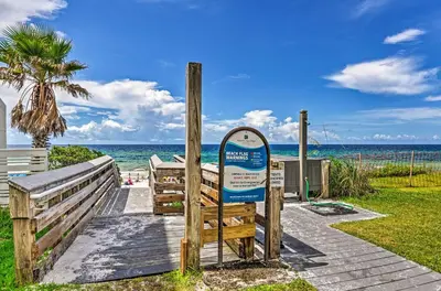 a sign on a wooden walkway to the beach at Seagrove Beach Studio - quarter Mi to Beach Access! in Santa Rosa Beach
