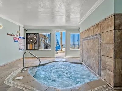 a jacuzzi tub in the middle of a room at Regency Towers 505 in Panama City Beach