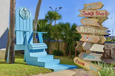 a sign for a resort with a blue staircase at Top Of The Gulf 621 in Panama City Beach