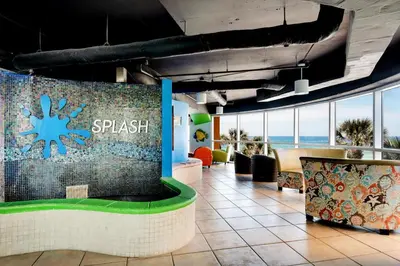 a lobby of a resort with a splash wall at Splash 1802E in Panama City Beach
