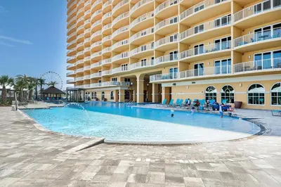 a large swimming pool in front of a large building at Calypso 3-807 in Panama City Beach