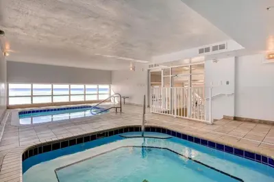 a swimming pool in the middle of a building at Tidewater 3011 in Panama City Beach