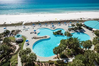 an aerial view of a resort swimming pool and the beach at Edgewater Villa #2104 in Panama City Beach