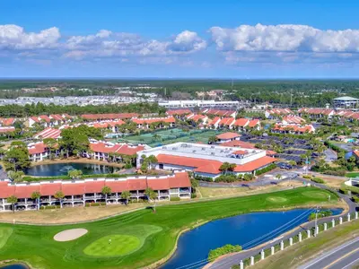 an aerial view of a resort with a golf course at Edgewater Tower I 211 in Panama City Beach