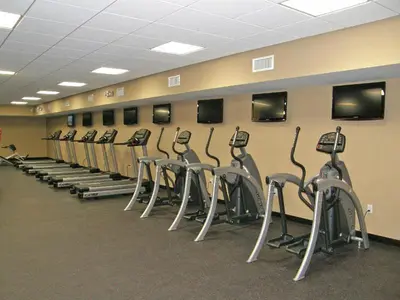 a row of exercise bikes lined up against a wall at Emerald Beach #2435 in Panama City Beach