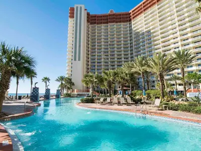 a swimming pool in front of a hotel at Shores of Panama #1510 in Panama City Beach