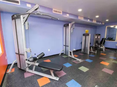 a room with a gym with a treadmill at Shores of Panama #1611 in Panama City Beach
