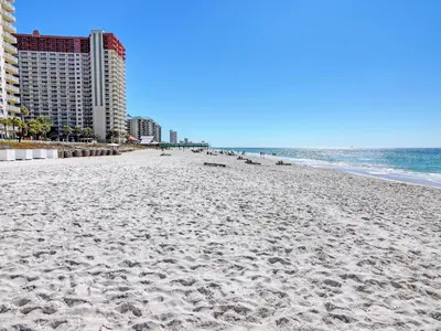 a sandy beach with buildings and the ocean at Long Beach Resort Tower III #905 in Panama City Beach