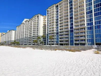 a row of tall buildings on the beach with a white beach at Long Beach Resort Tower I #503 in Panama City Beach