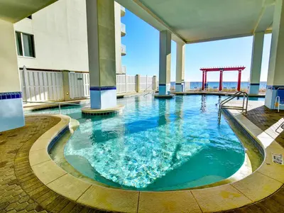 a large swimming pool in a building with a playground at Majestic Beach Towers I #1703 in Panama City Beach