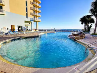 a large swimming pool next to a building at Majestic Beach Towers I #1311 in Panama City Beach