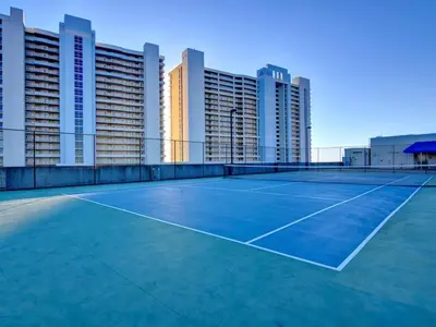 a tennis court in front of some tall buildings at Majestic Beach Towers I #207 in Panama City Beach