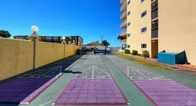 an empty street with purple and pink mats on the ground at Summit Beach Resort 430 in Panama City Beach