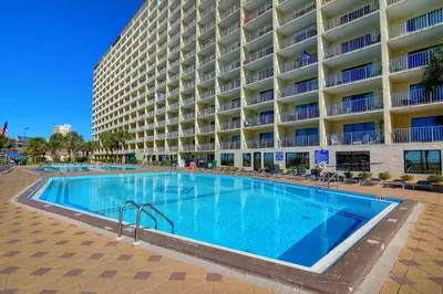 a large swimming pool in front of a large building at Summit Beach Resort 430 in Panama City Beach