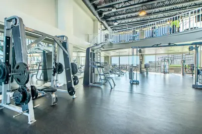 a gym with rows of equipment in a large room at Laketown Wharf 116 in Panama City Beach