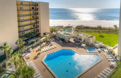 an aerial view of a resort with a swimming pool and the ocean at Top of the Gulf 208 in Panama City Beach