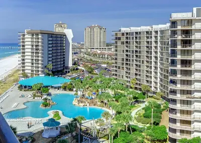 an aerial view of a resort with a pool and buildings at Edgewater Golf Villa 2010 in Panama City Beach