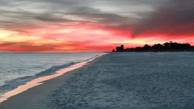a view of a beach with a sunset at Beachcrest 204 in Santa Rosa Beach