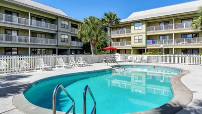 a swimming pool in front of a apartment building at Beachwood Villas 12I in Santa Rosa Beach