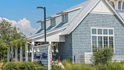 a blue and white house with a street light at Mistral 1 Bare Feet Retreat in Seacrest