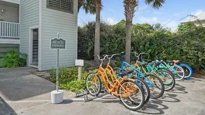 a row of bikes parked outside of a house at Mistral 10 in Seacrest