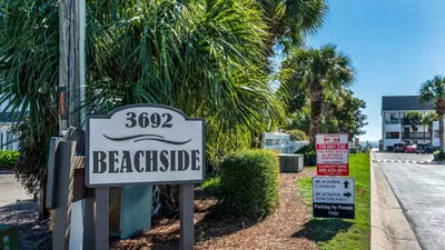 a sign for a beachside sign for a house at Beachside Condo 14 in Santa Rosa Beach