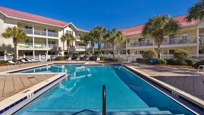 a swimming pool in front of a apartment complex at Rollin Tide C2 - Seaglass Sands in Santa Rosa Beach
