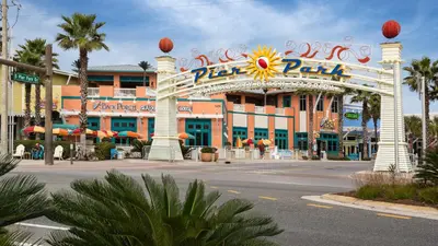a large building with a sign for a theme park at Leo's Hideaway in Panama City Beach