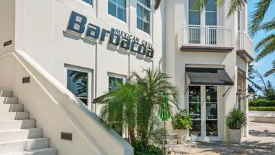 a rendering of the exterior of a hotel at License To Chill in Inlet Beach