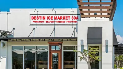 a building with a sign that reads design ice market at Beach Daze in Panama City Beach