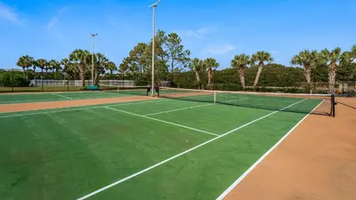 a tennis court with a net on top of it at Sand Cliffs 405 - Sunsets on the Bluff at Sand Cliffs in Seacrest