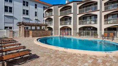 a swimming pool in front of a apartment building at Dune Villas 5B - Sand In My Shoes in Santa Rosa Beach