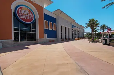 a building with a dallas buffier sign on the sidewalk at 140 Feet To White Sandy Beaches! Newly Renovated! Pool! Grill! in Panama City Beach