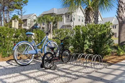 two bikes parked next to each other on a sidewalk at 24 York Lane | Edgewater Escape in Inlet Beach