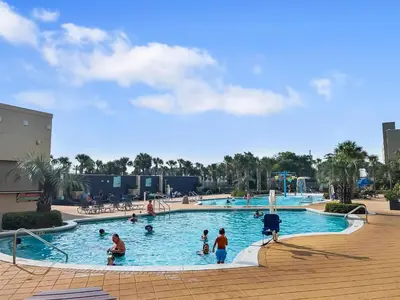 a group of people in a large swimming pool at Emerald Beach Resort by Blue Swell in Panama City Beach