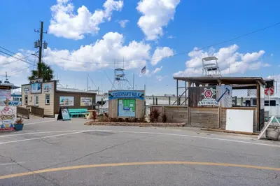 an empty parking lot next to a gas station at Beautiful 3rd Floor Condo w Gulf Front Master - Near Pier Park in Panama City Beach