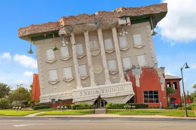 a large building with a sign in front of it at Beautiful 3rd Floor Condo w Gulf Front Master - Near Pier Park in Panama City Beach