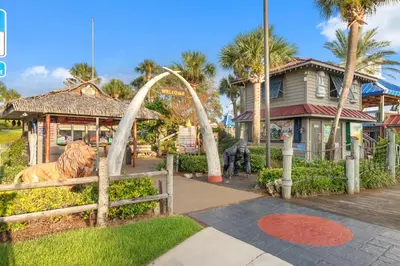 a park with a statue of a tiger in front of a house at 20th Floor Condo! Sleeps 8! Gulf Front Master Suite w/ Beautiful Gulf Views! in Panama City Beach