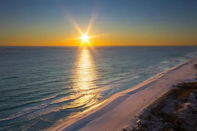 an aerial view of the ocean at sunset at Brand New Home with In-ground Pool, Four Houses From Beautiful Laguna Beach in Panama City Beach