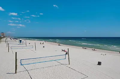 a beach with a group of volleyball nets on it at Welcome to Dolphin Fun A! BRAND NEW Duplex! Walk to the Beach! in Panama City Beach