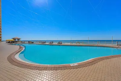 a large swimming pool next to the beach at Treasure Island #2110 in Panama City Beach