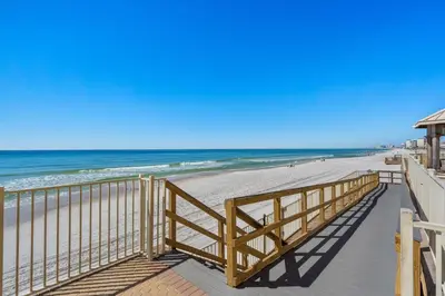 a boardwalk leading to a beach with the ocean at Treasure Island #2306 in Panama City Beach